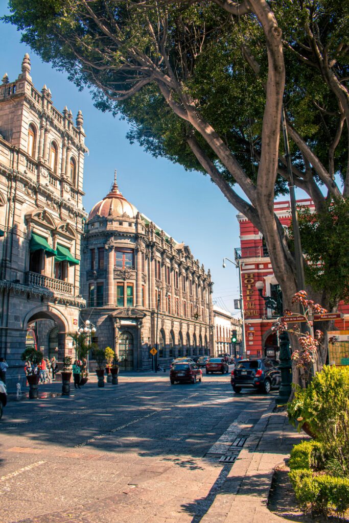 Street view of historic Puebla architecture in a vibrant cityscape.
